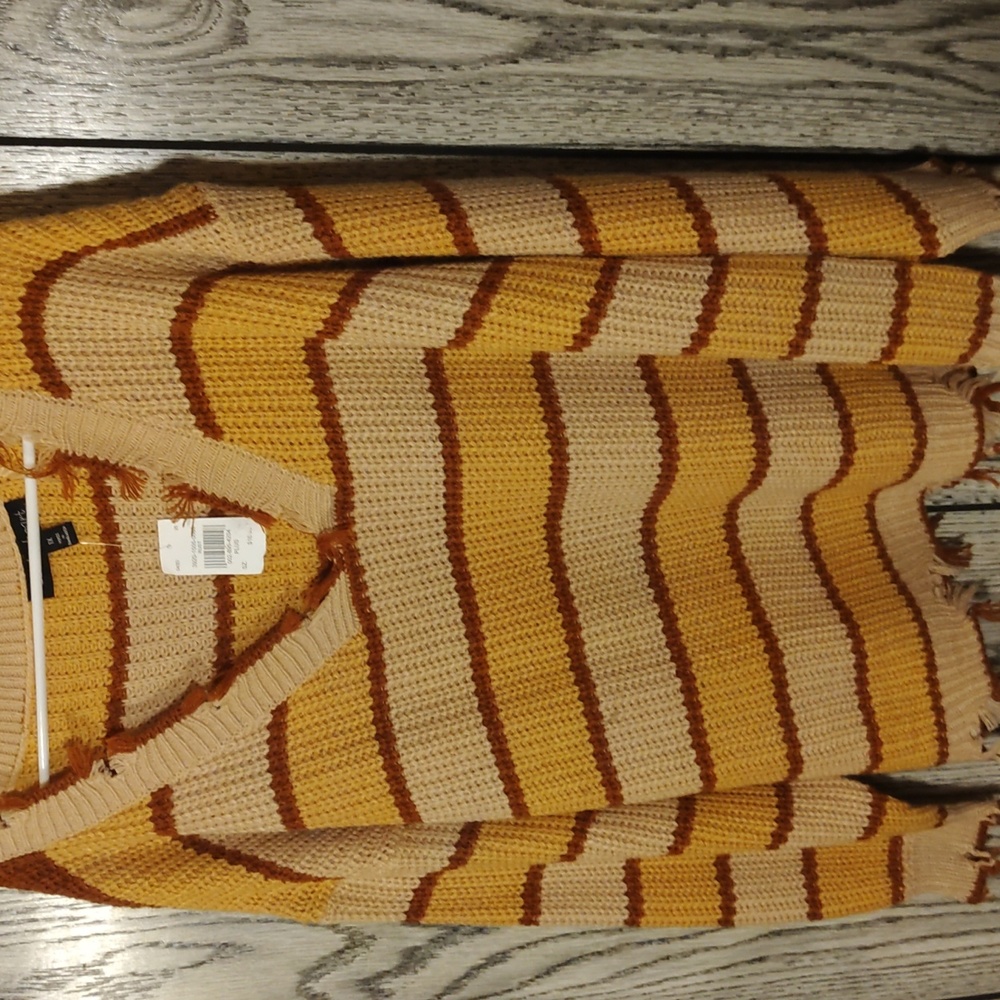 0range striped sweater, frayed at ends